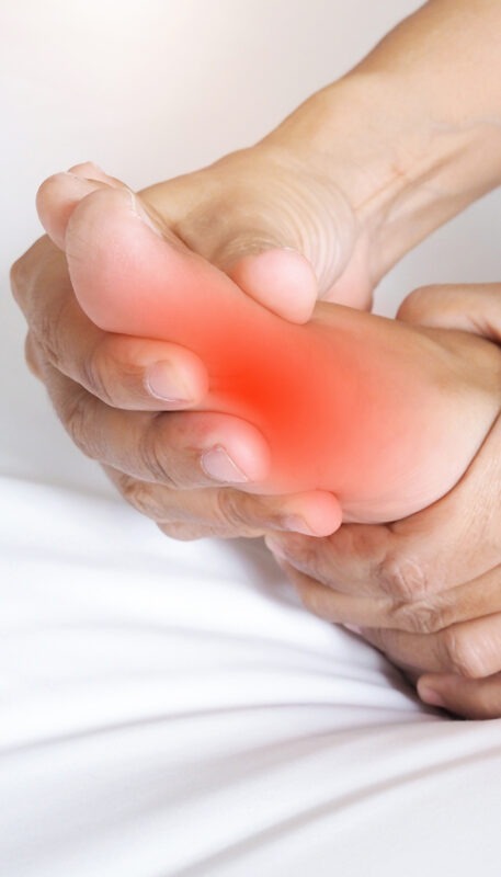 Asian people suffering from severe foot pain. hands reflexology